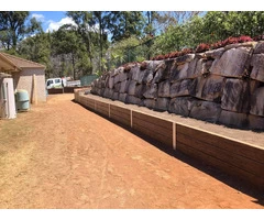 Concrete sleeper retaining wall - Side and back. - Rogers Little Loaders