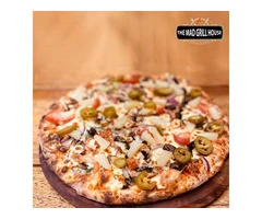 Deliciously Crispy: Experience our Wood Fired Oven Pizza at Mad Grill