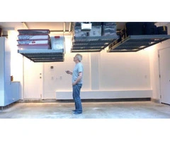 Motorised overhead garage storage