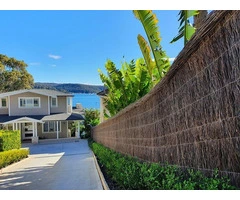 Elegant Outdoor Privacy Delivered through Custom brush fencing solutions