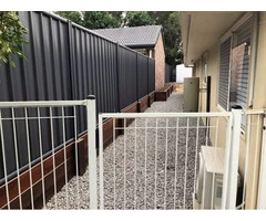 Old fence and retaining wall replacement on April 12 - Rogers Little Loaders