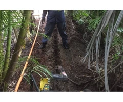 Trenching for electrical cable - Rogers Little Loaders.