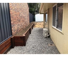 Old fence and retaining wall replacement on April 12 - Rogers Little Loaders.